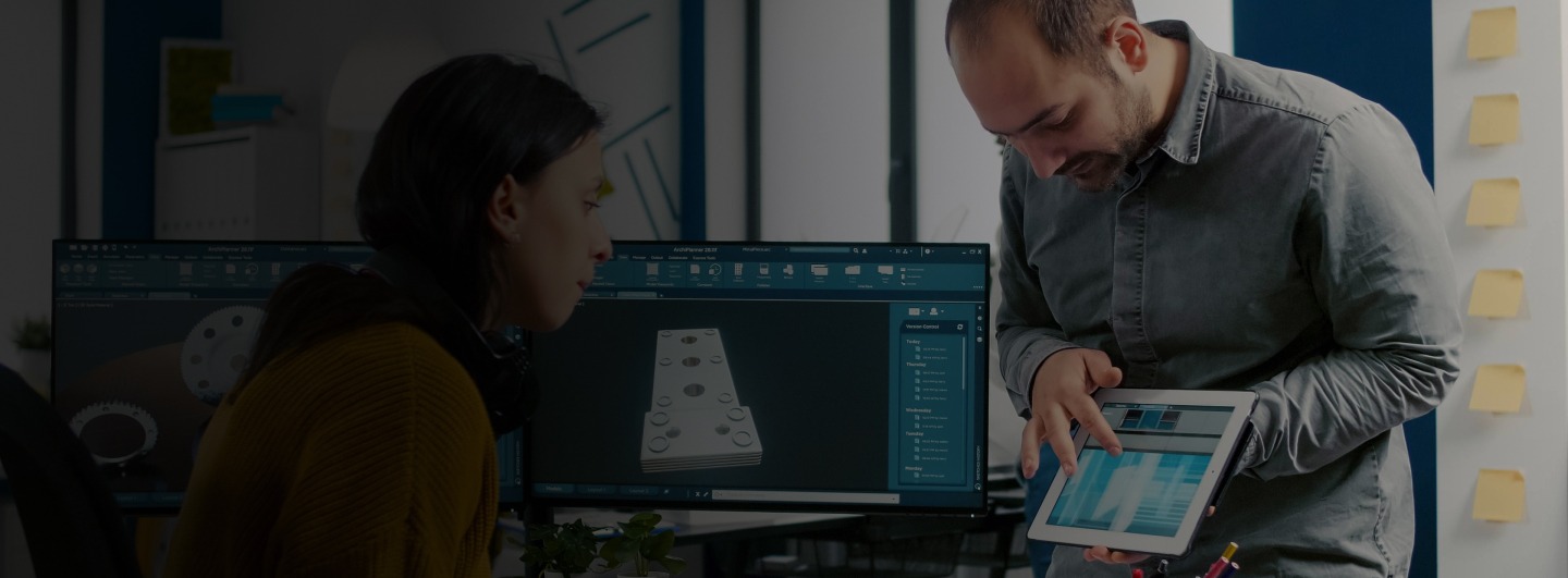 man showing woman information on a tablet