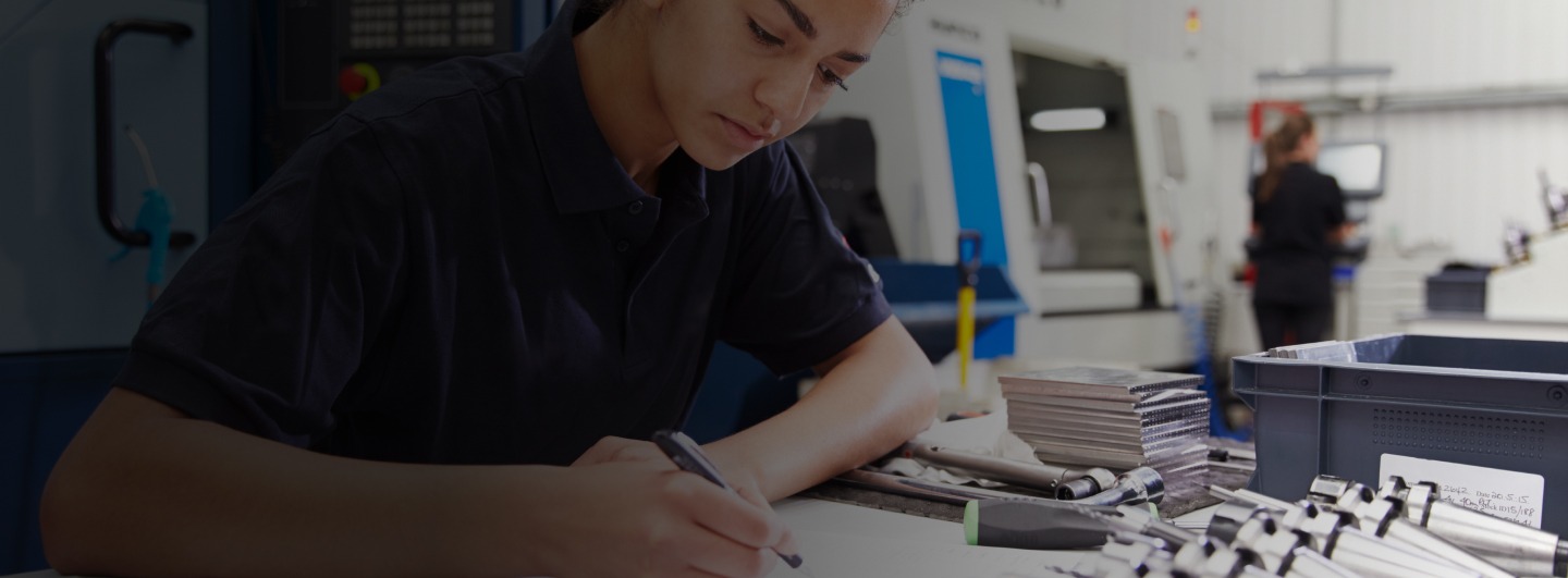 girl working with pen to paper