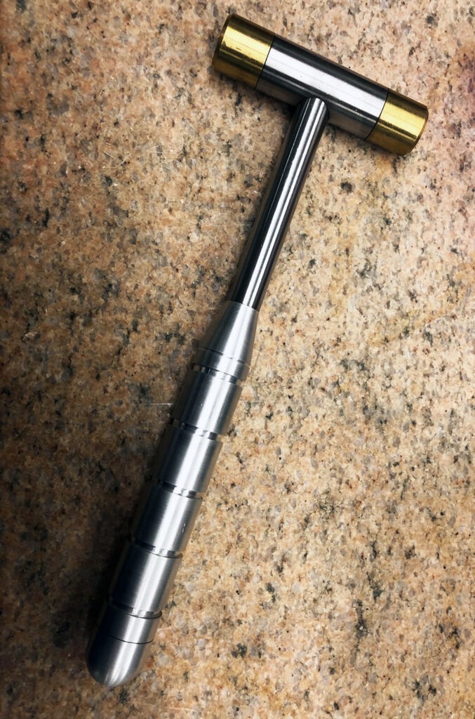 Silver metal machinist hammer with gold tips
