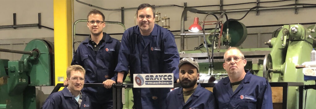 Five male Grayco Machine employees in their warehouse