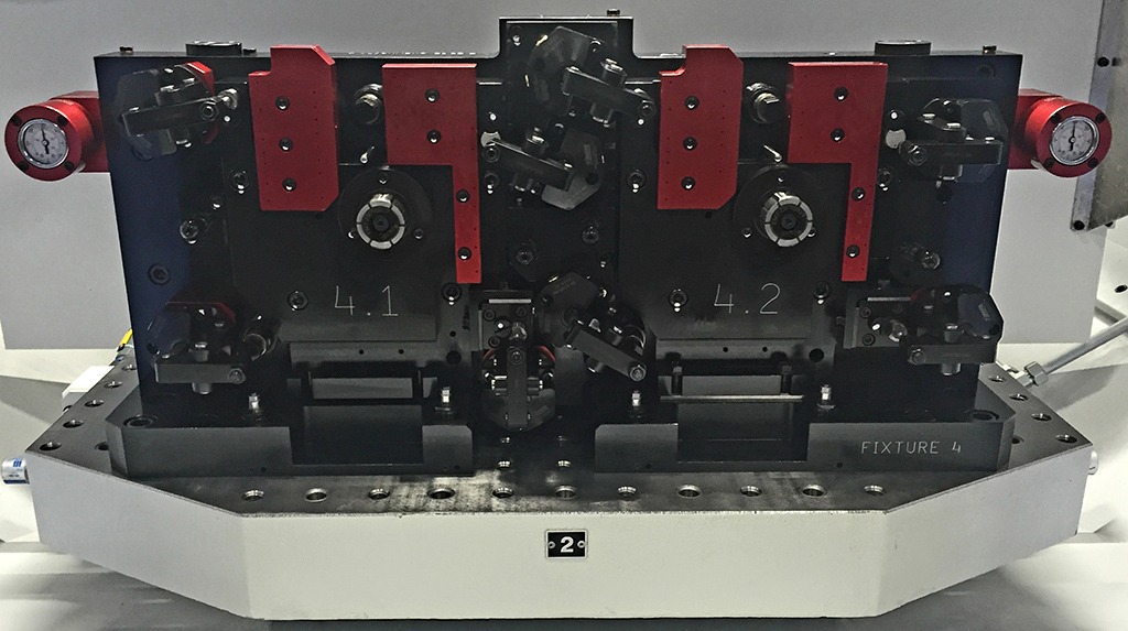 Black and red metal hydraulic workholding fixtures