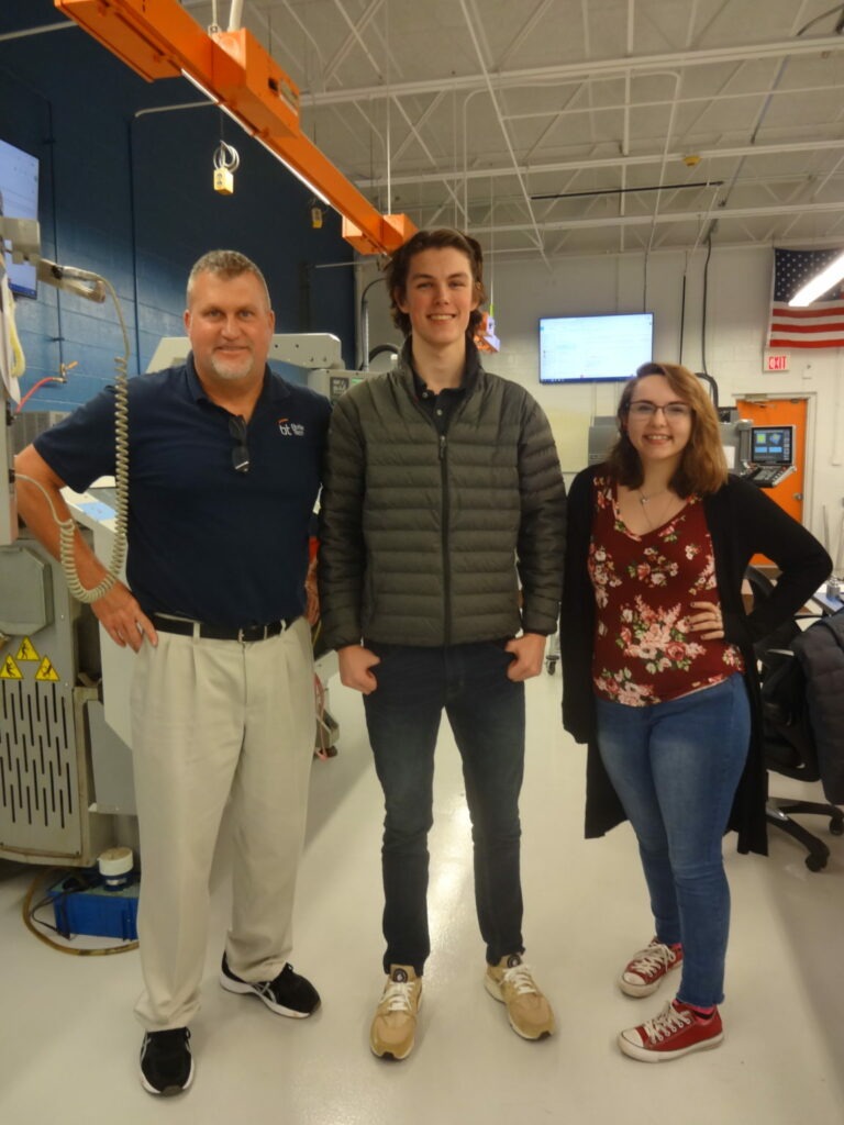 Precision machining instructor and two students