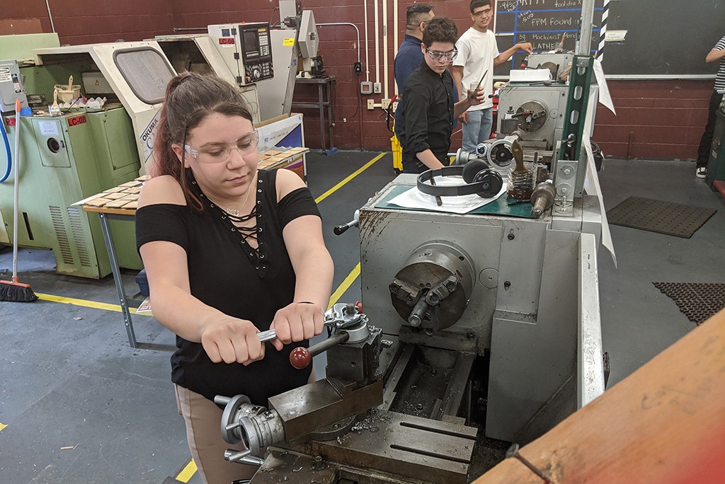 Students learning manual machining 