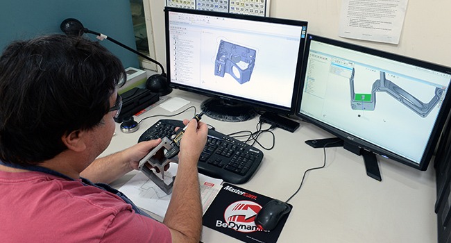 Man working at computer designing with Mastercam