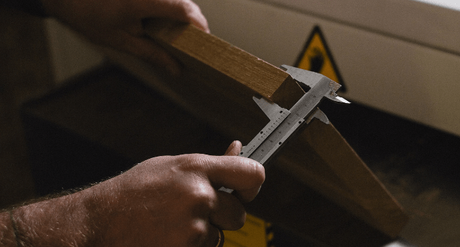 Man measuring wood