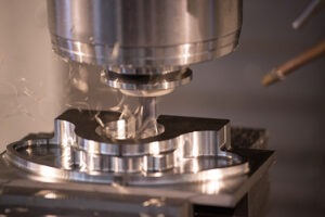 A drill machining a part