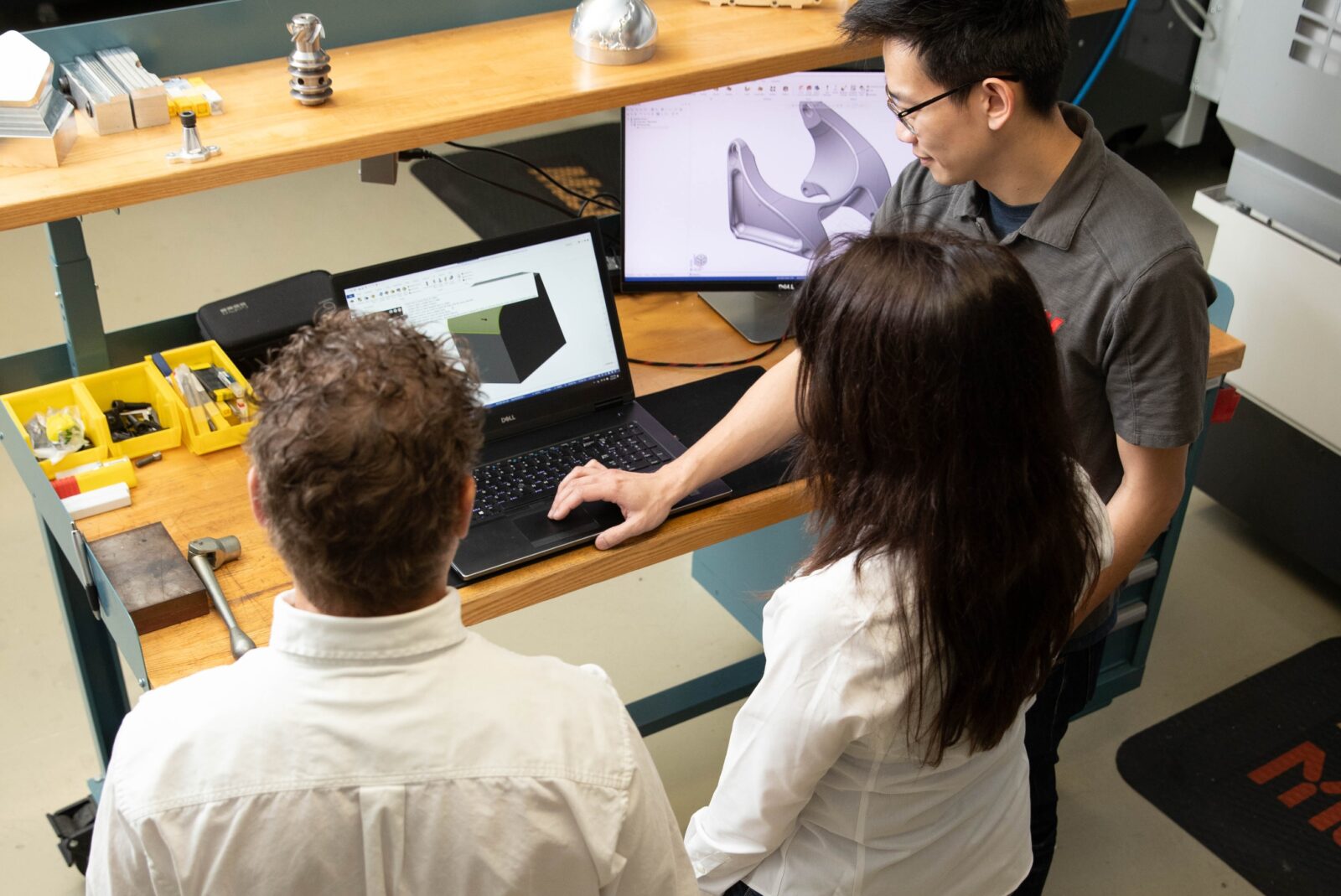 Diverse group working with Mastercam software