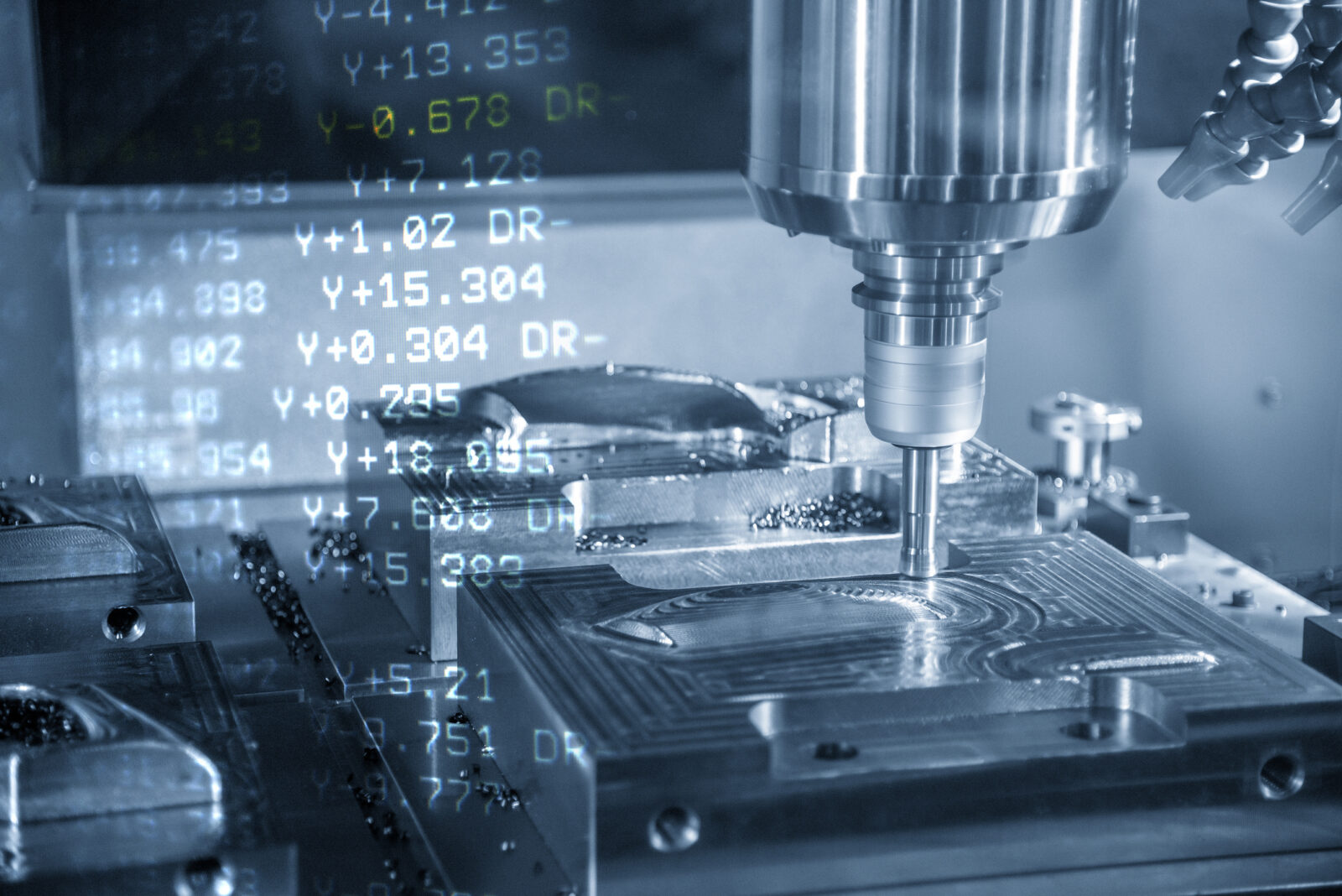 Mastercam lathe with computer code overlaid