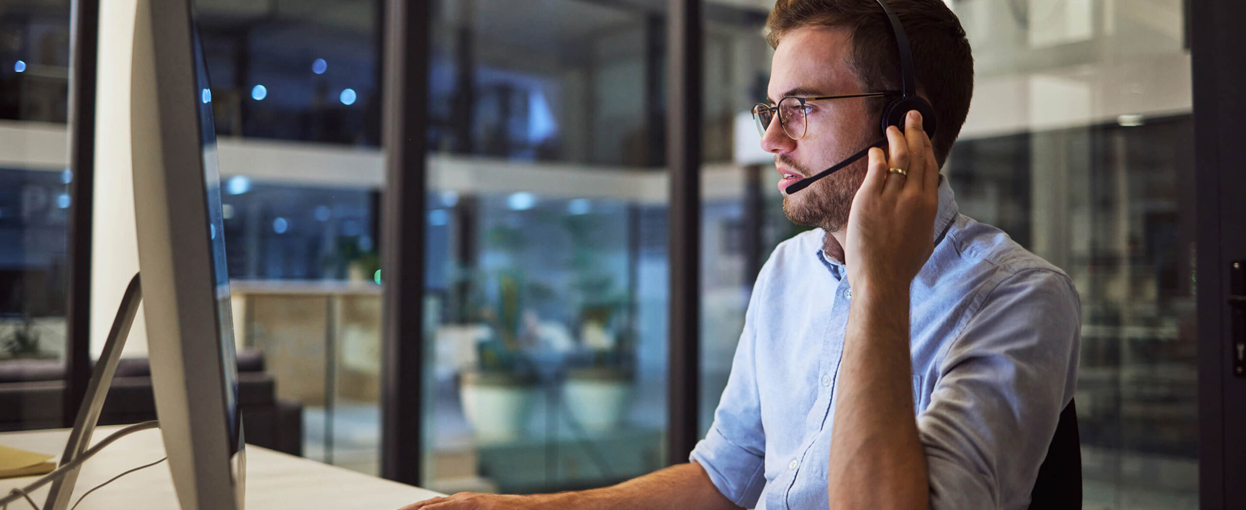 Support technician at a computer workstation