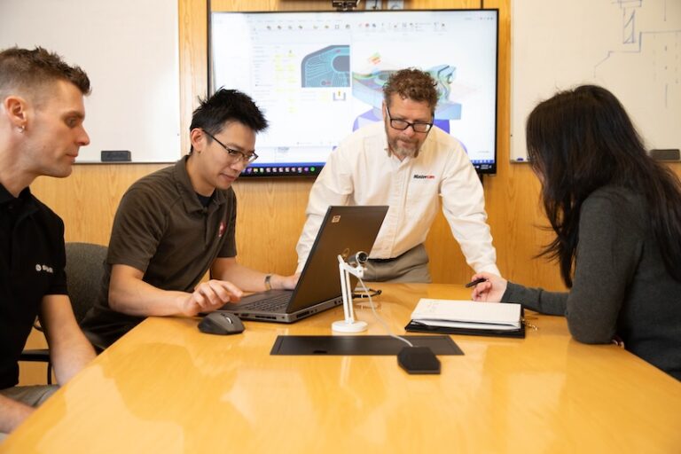 Team huddled in a conference room