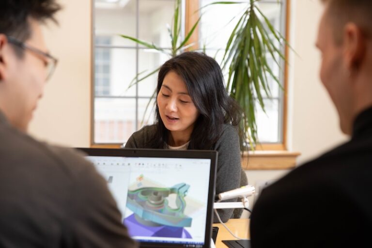 Group working on laptops in a conference room