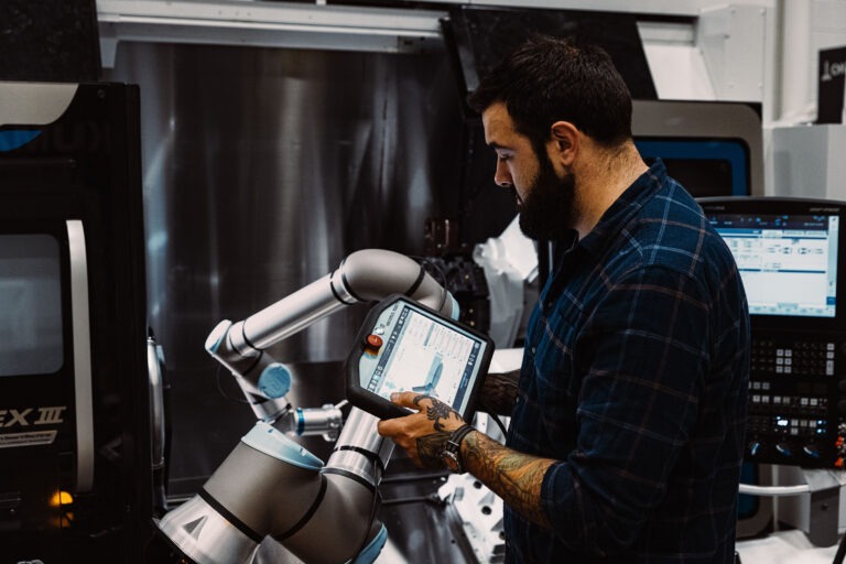 Man in machine looking at detail on a screen
