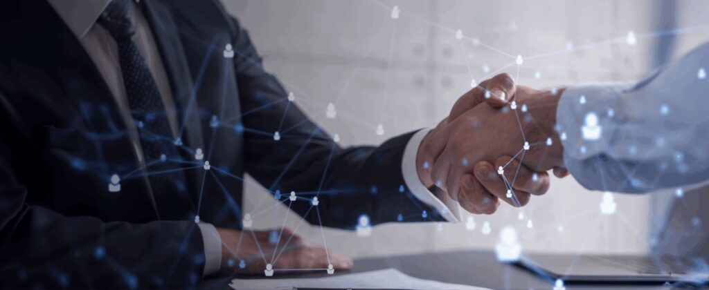 Close up of men shaking hands.